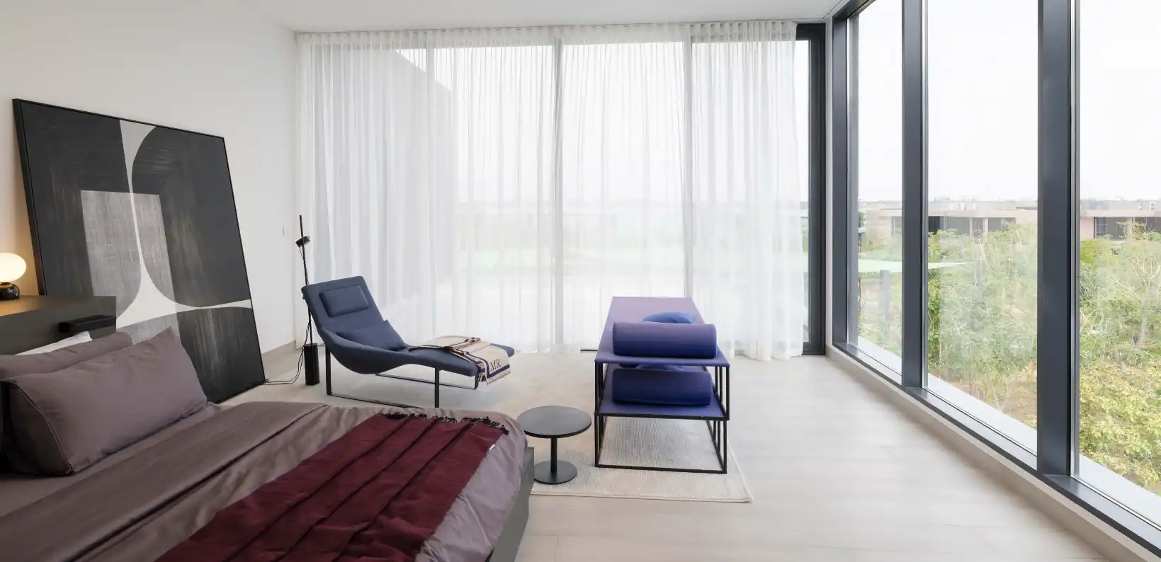 Master bedroom with private garden view at Anber by Arada
