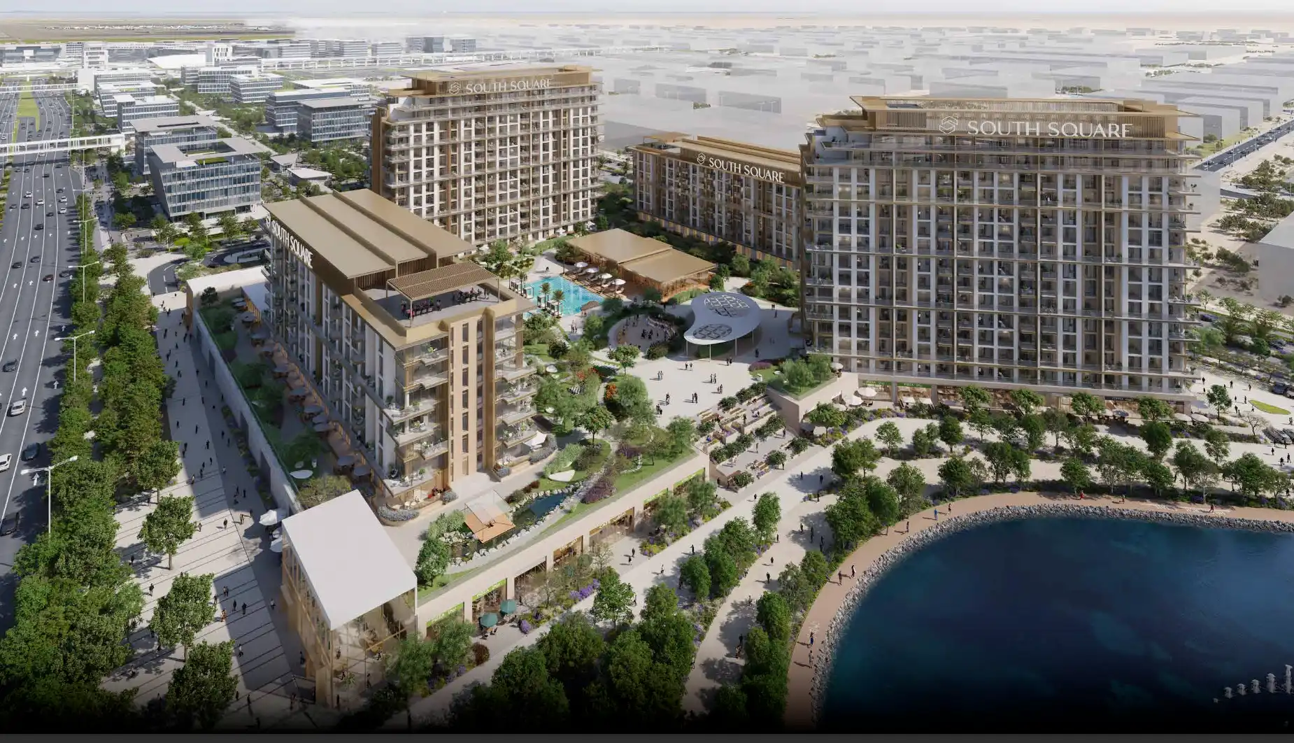 Drone view of South Square residences beside water feature