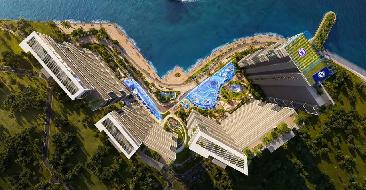 Aerial drone view of Chelsea Residences with sea and skyline